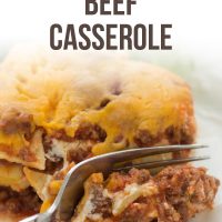 A slice of Layered Italian Beef Casserole being cut by a fork