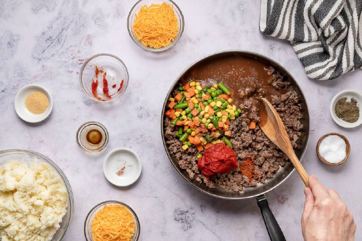 ingredients for preparing shepherd's pie in a skillet