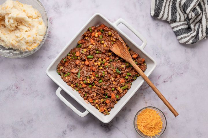 beef and vegetable mixture for shepherd's pie in a baking pan