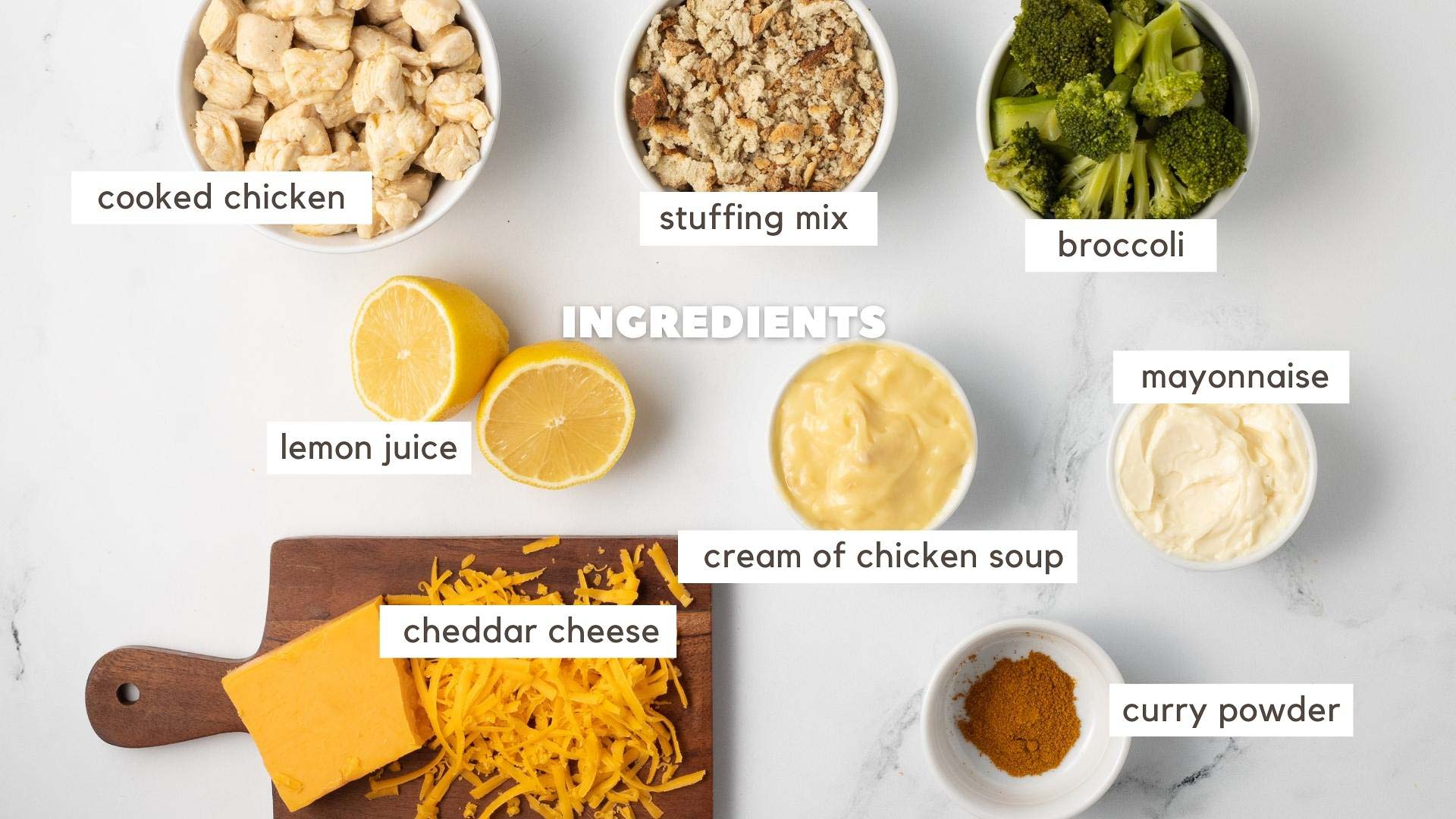 Ingredients for Chicken Divan with Curry: cooked chicken, stuffing mix, broccoli, lemon juice, cream of chicken soup, mayonnaise, cheddar cheese, and curry powder.