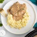 Cube steak with mushroom soup gravy served over mashed potatoes.