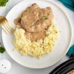 Cube steak with mushroom soup gravy served over mashed potatoes.