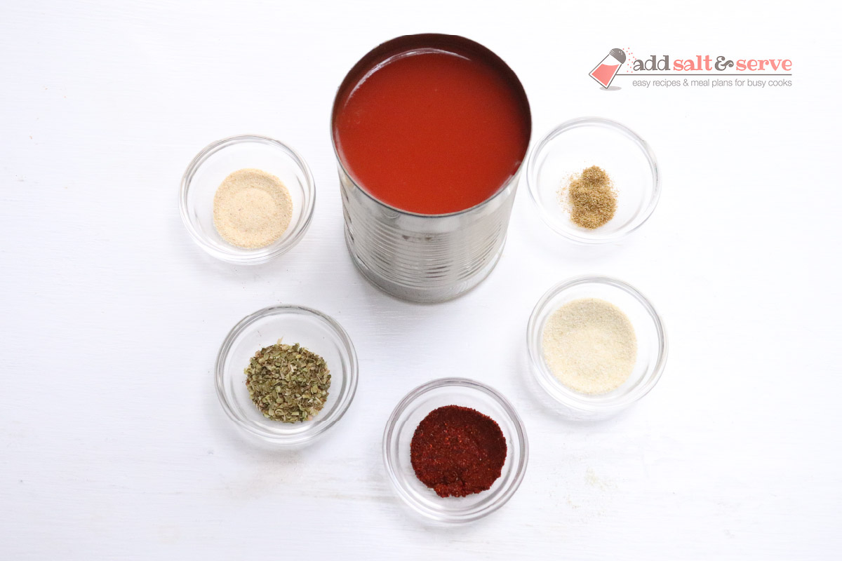 Ingredients for mojado sauce in glass demi bowls.