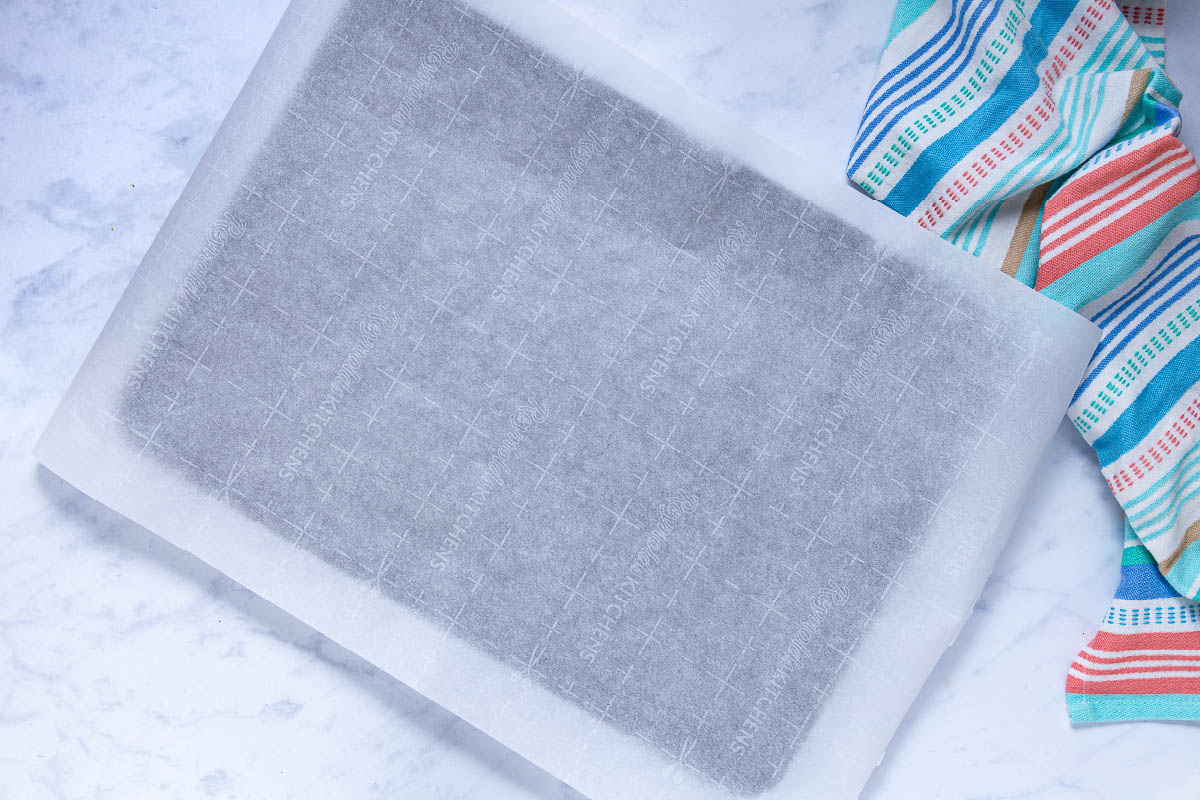 An empty baking sheet lined with parchment paper
