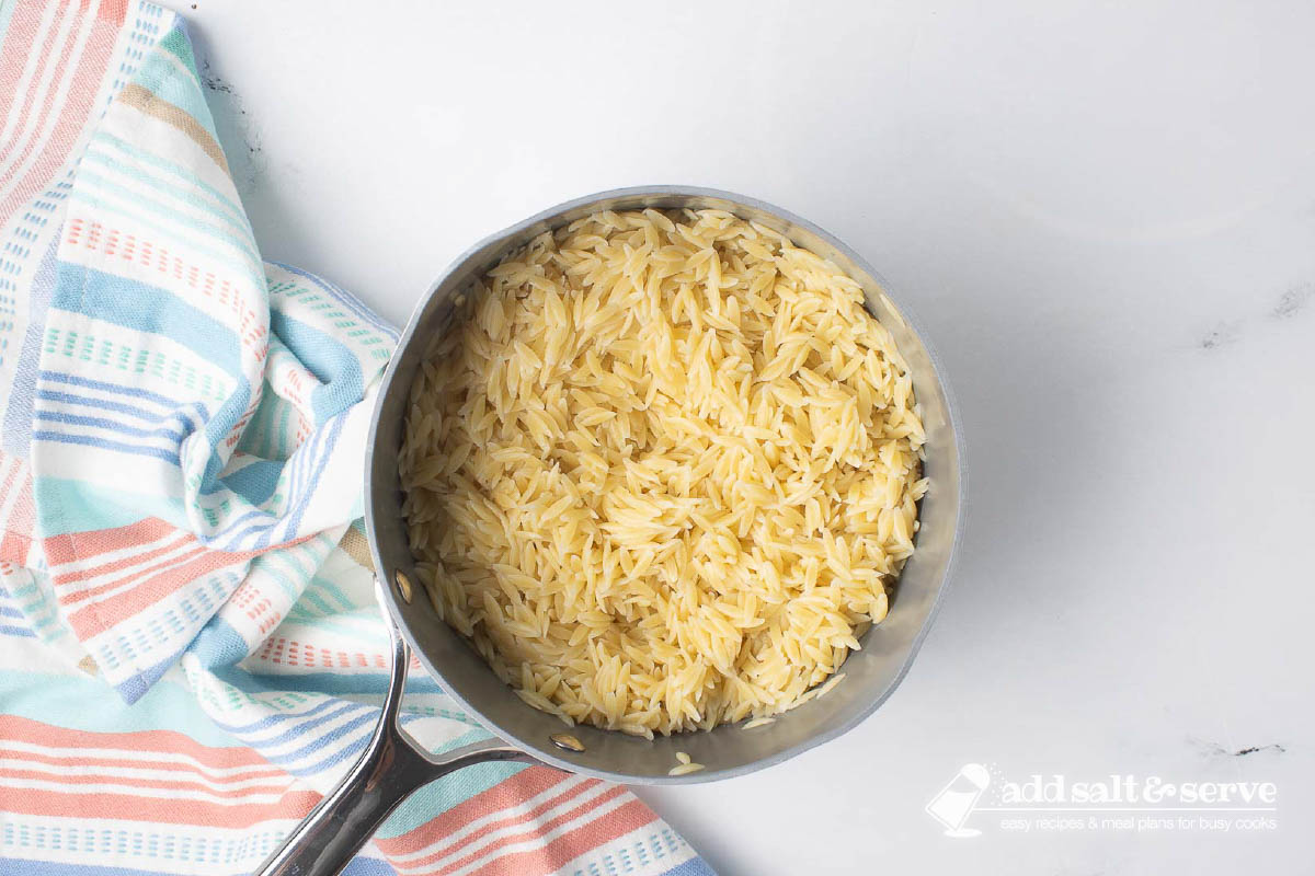 Cooked orzo in a pot.