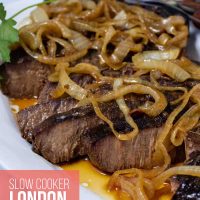 Sliced crock pot London Broil with au jus topped with tender onions.