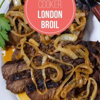 Sliced crock pot London Broil with au jus topped with tender onions.