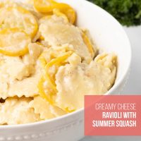 Bowl of creamy summer squash and cheese ravioli in a cheese sauce with text Creamy Cheese Ravioli with Summer Squash.