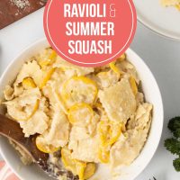 Bowl of creamy summer squash and cheese ravioli in a cheese sauce with text Creamy Cheese Ravioli with Summer Squash.