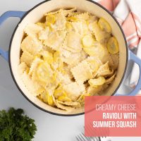 Dutch oven of creamy summer squash and cheese ravioli in a cheese sauce.