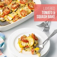 Baked layered casserole of yellow squash, zucchini, and tomatoes with herbs and cheese in a baking dish with a serving on a plate beside the dish and text Layered Tomato & Squash Bake.
