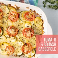 Baked layered casserole of yellow squash, zucchini, and tomatoes with herbs and cheese in a baking dish with text Tomato & Squash Casserole.