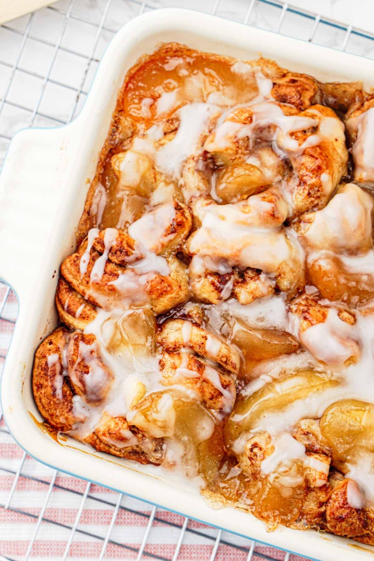 Apple cinnamon roll bake with glaze on top.
