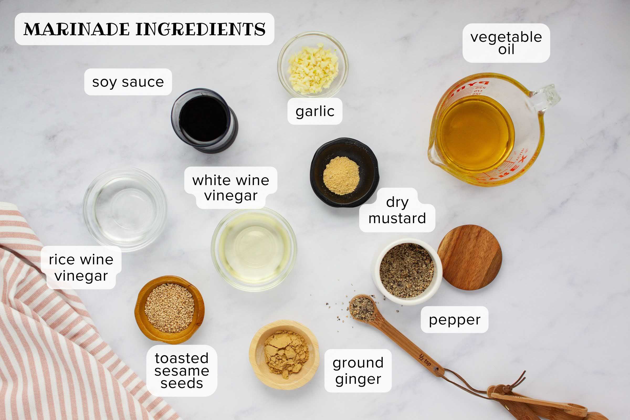 Ingredients for sesame marinade: soy sauce, minced garlic, vegetable oil, rice wine vinegar, white wine vinegar, dry mustard, toasted sesame seeds, ground ginger, black pepper.